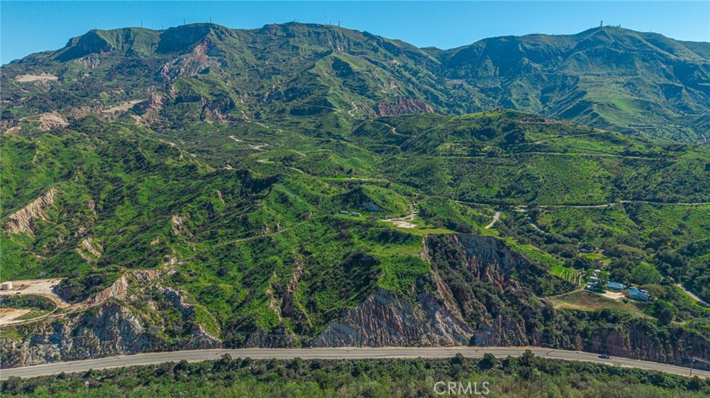 18500 South Mountain Road Santa Paula, CA 93060 - Photo 5 of 35 a view of a house with a lush green forest
