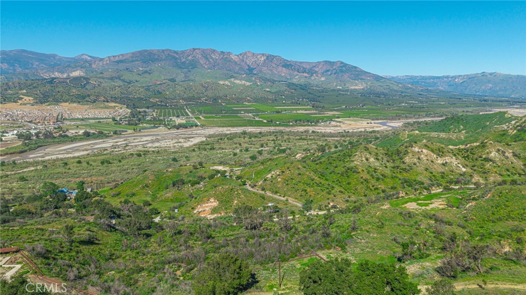18500 South Mountain Road Santa Paula, CA 93060 - Photo 8 of 35 a view of a lush green hillside and a building