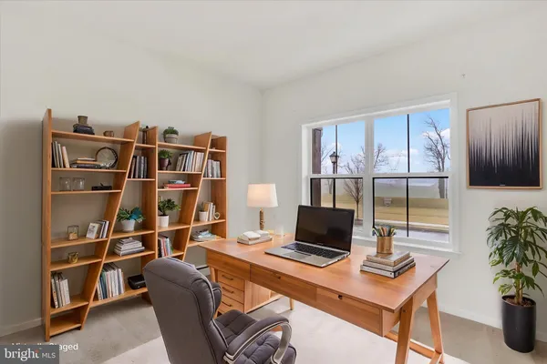 a view of a workspace with furniture