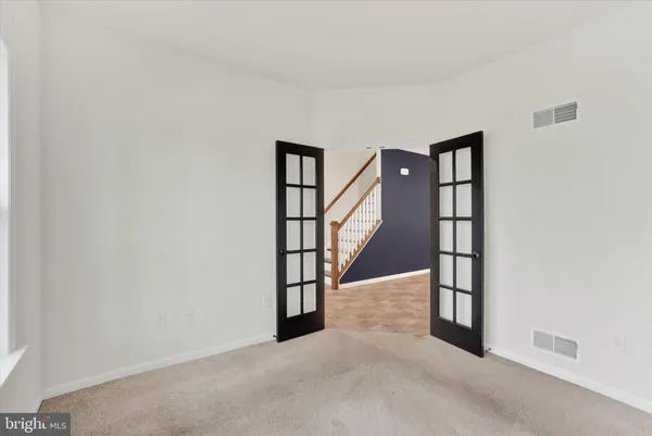 a view of entryway with stairs and wooden floor