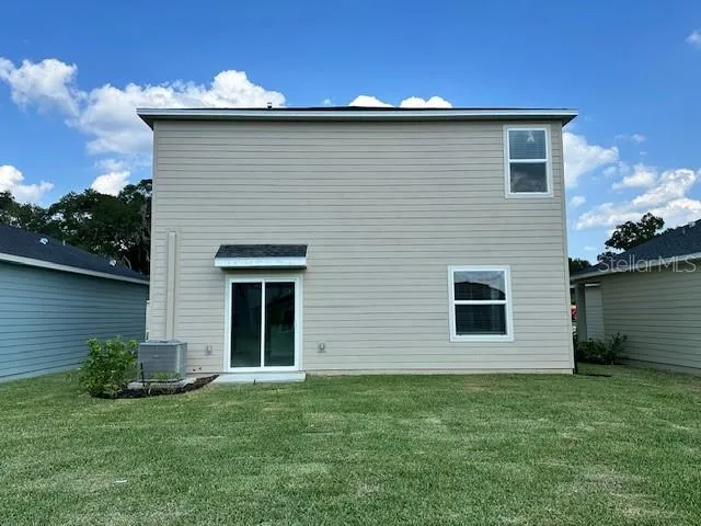 a brick house with a small yard