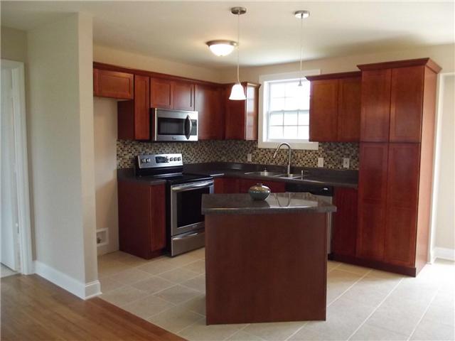 3324 Country Way Road Antioch, TN 37013 - Photo 13 of 18 a kitchen with stainless steel appliances granite countertop a stove a refrigerator and a sink