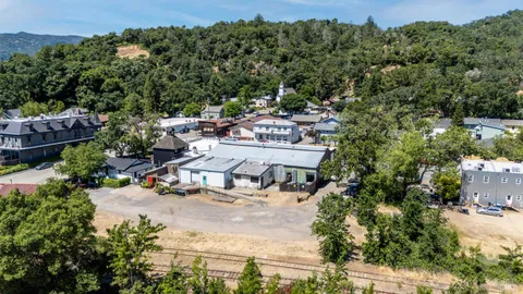 an aerial view of residential house with outdoor space