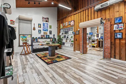 a view of a living room with furniture and a rug