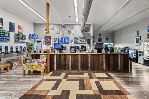 a living room with lots of furniture and wooden floor