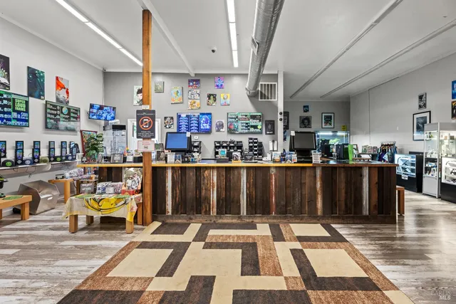 a living room with lots of furniture and wooden floor
