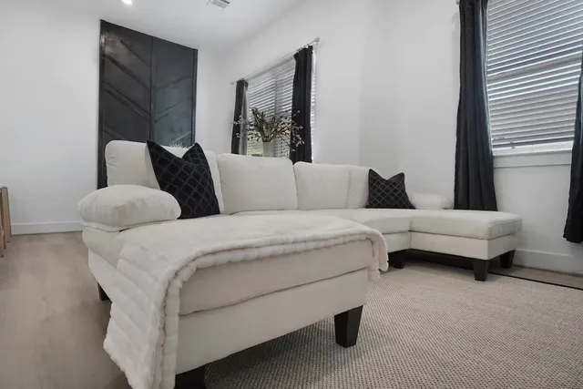 a living room with furniture and a couch