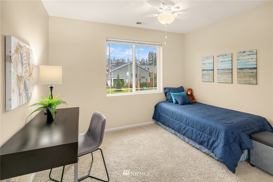 17628 39th Avenue Southeast Bothell, WA 98012 - Photo 22 of 30 a living room with furniture and a potted plant