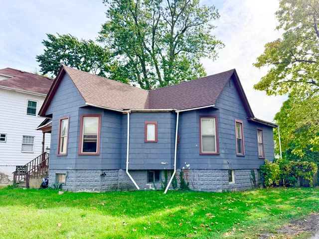 a brick house with a small yard and a small yard