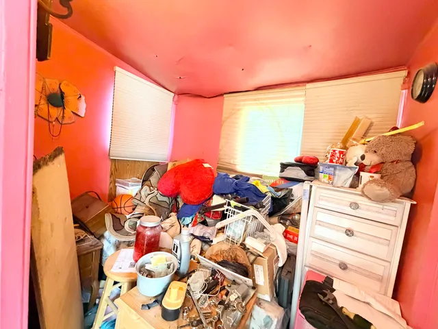 a bed room with a bed and a window