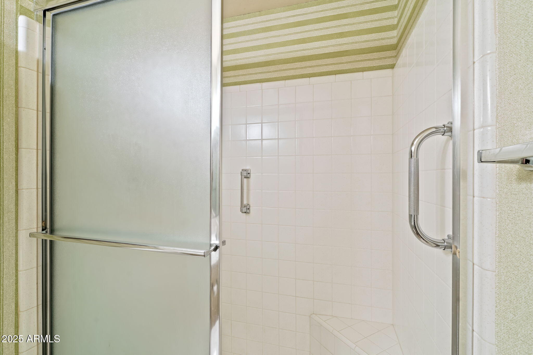7706 East Chaparral Road Scottsdale, AZ 85250 - Photo 20 of 33 a bathroom with a glass shower door