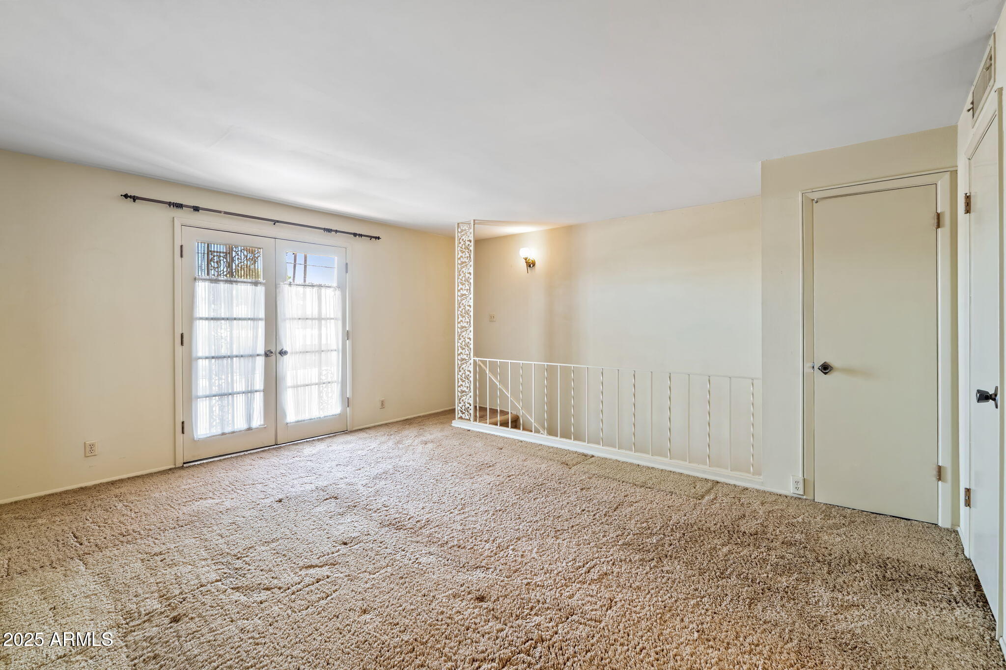 7706 East Chaparral Road Scottsdale, AZ 85250 - Photo 22 of 33 a view of an empty room with a window
