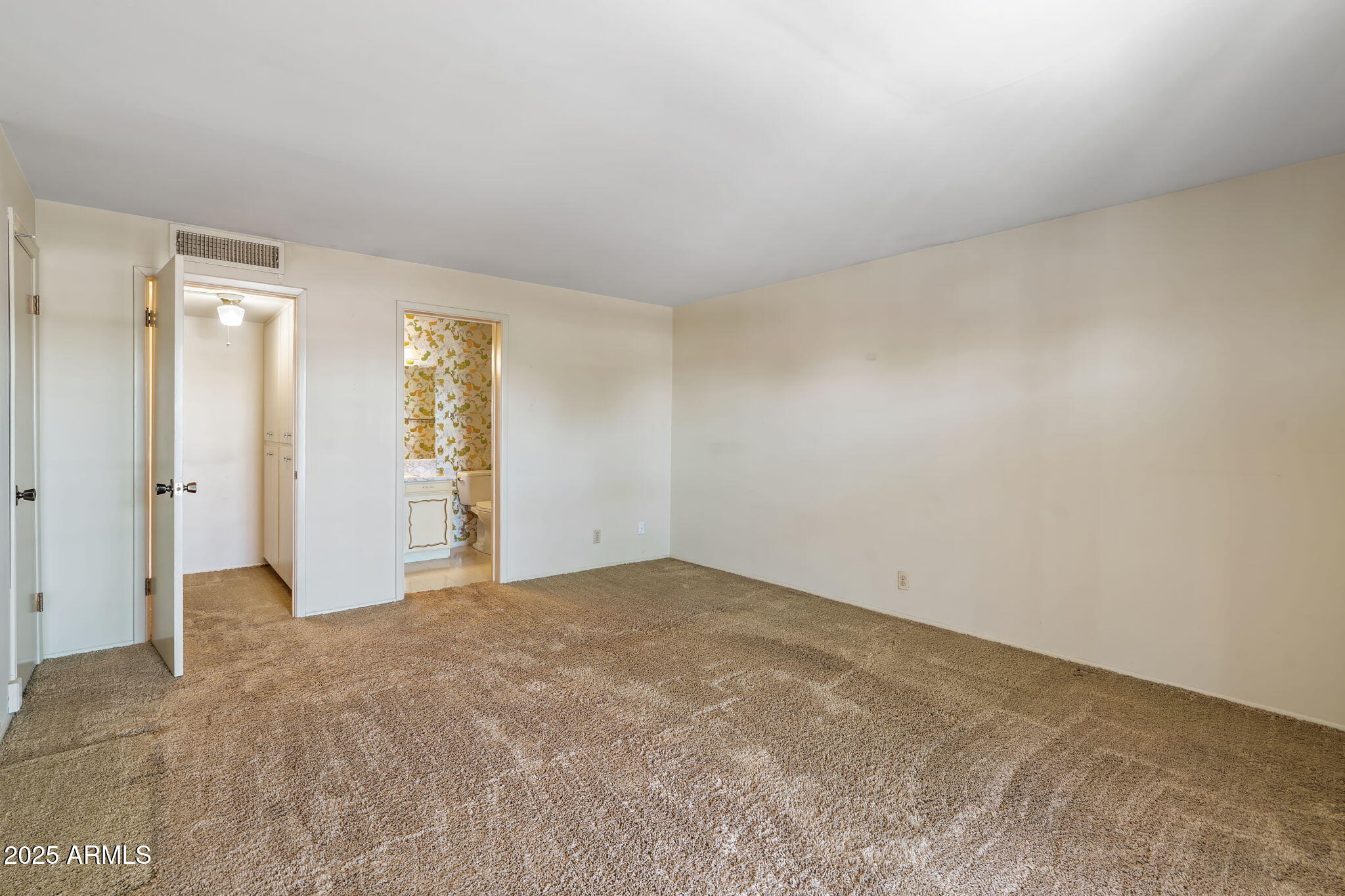 7706 East Chaparral Road Scottsdale, AZ 85250 - Photo 23 of 33 a view of an empty room and window
