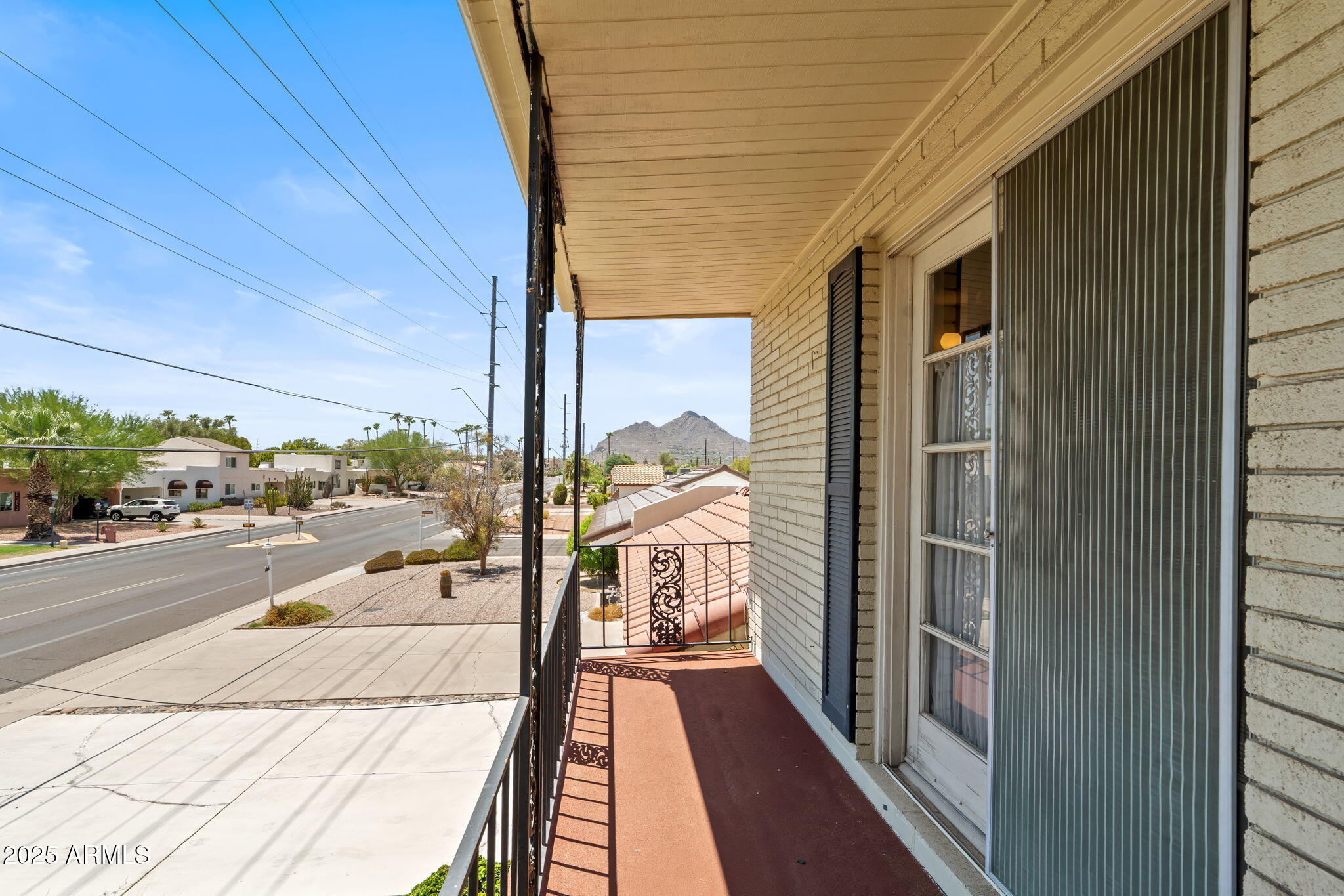 7706 East Chaparral Road Scottsdale, AZ 85250 - Photo 26 of 33 a view of a balcony with a potted plant
