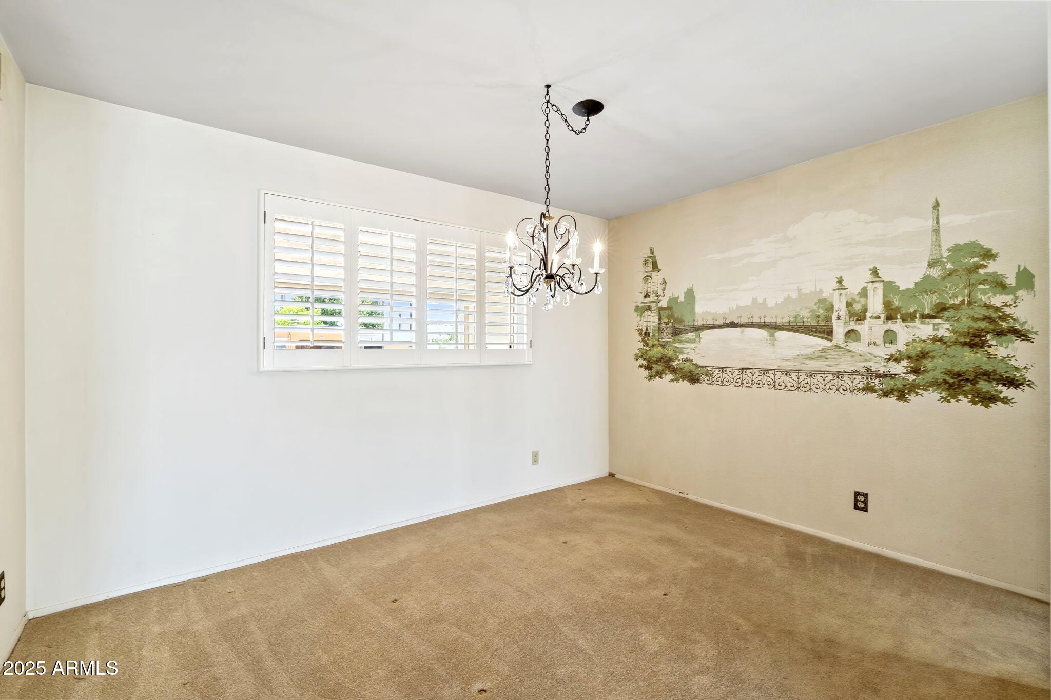 7706 East Chaparral Road Scottsdale, AZ 85250 - Photo 5 of 33 a view of a room with window and cabinet