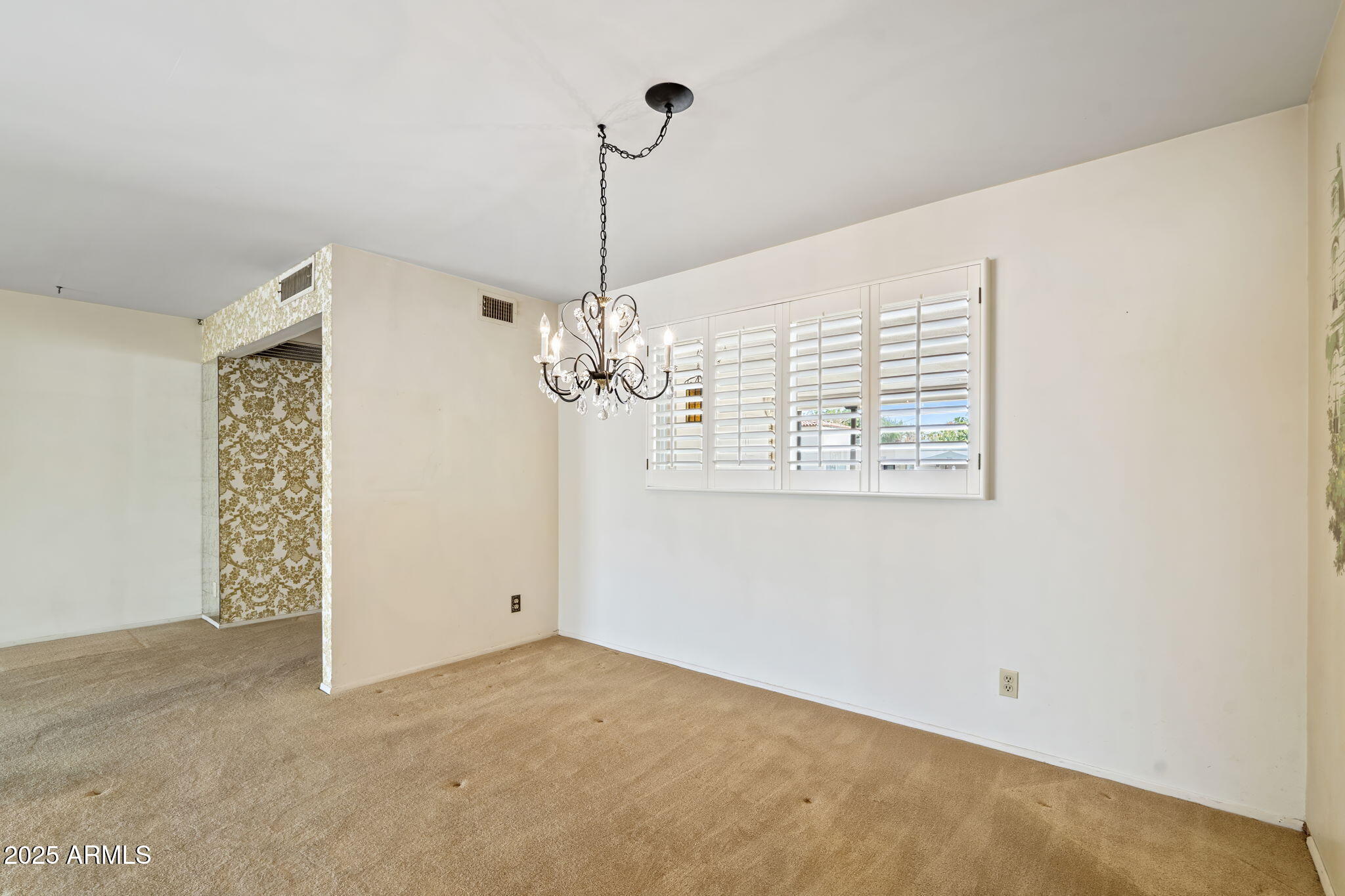 7706 East Chaparral Road Scottsdale, AZ 85250 - Photo 6 of 33 a view of a livingroom with a chandelier fan