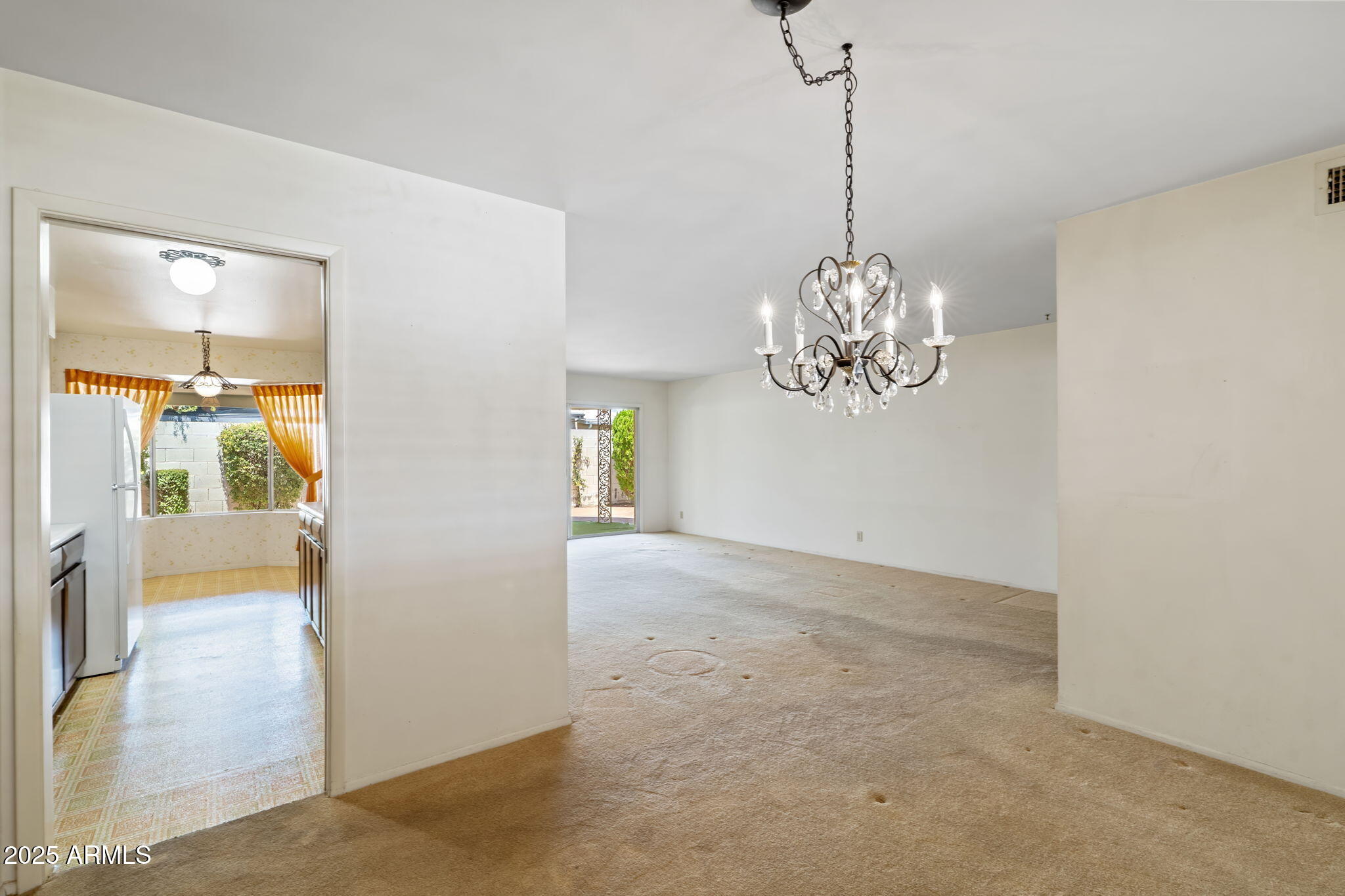 7706 East Chaparral Road Scottsdale, AZ 85250 - Photo 7 of 33 a view of a chandelier in big room and chandelier