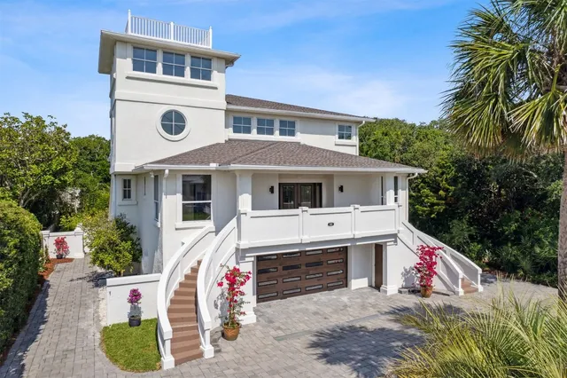 a front view of house with yard and swimming pool
