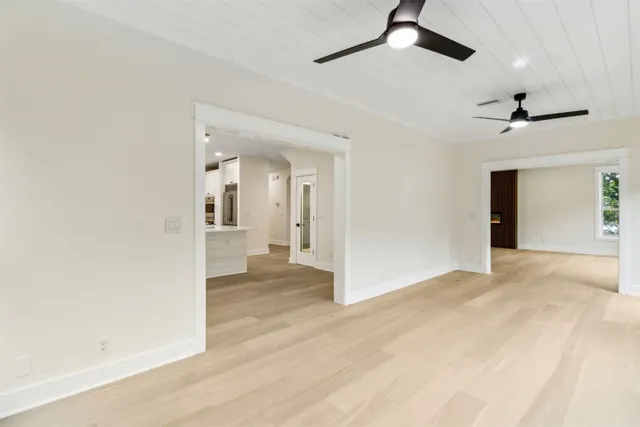 a view of walk in closet with empty racks