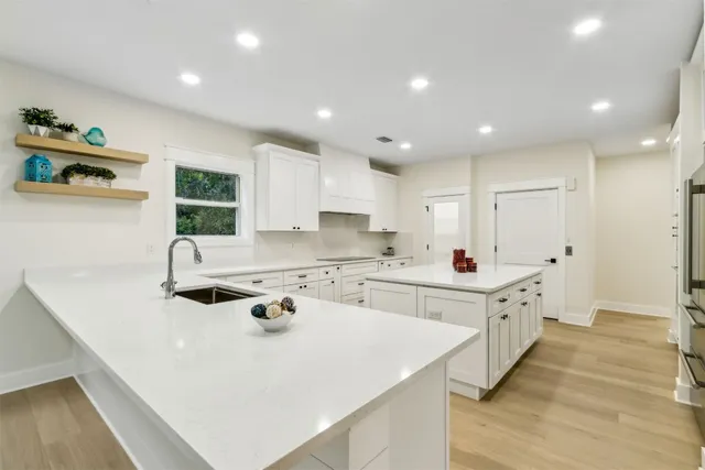 a view of an entryway with wooden floor