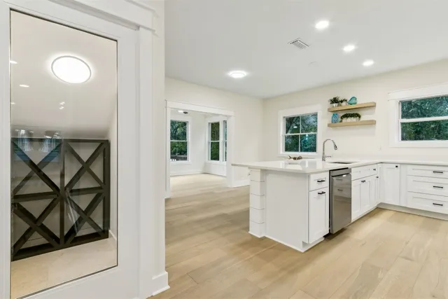 a view of a bathroom from a hallway