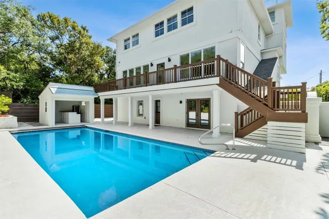 a view of a swimming pool with a porch