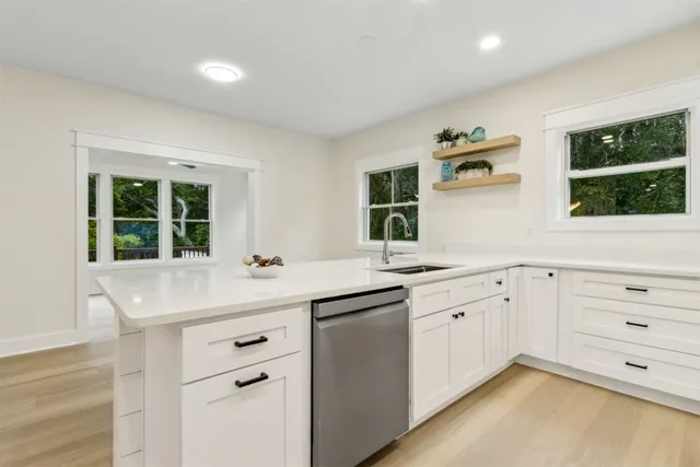 a view of a livingroom with furniture and window
