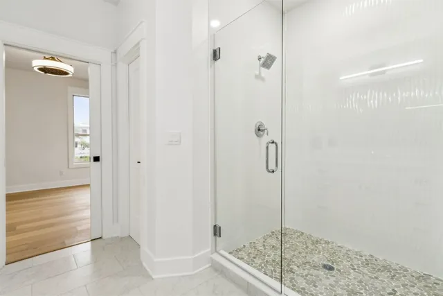 a kitchen with a sink and white cabinets