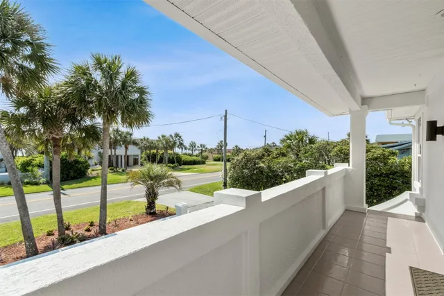a view of a livingroom with wooden cabinets
