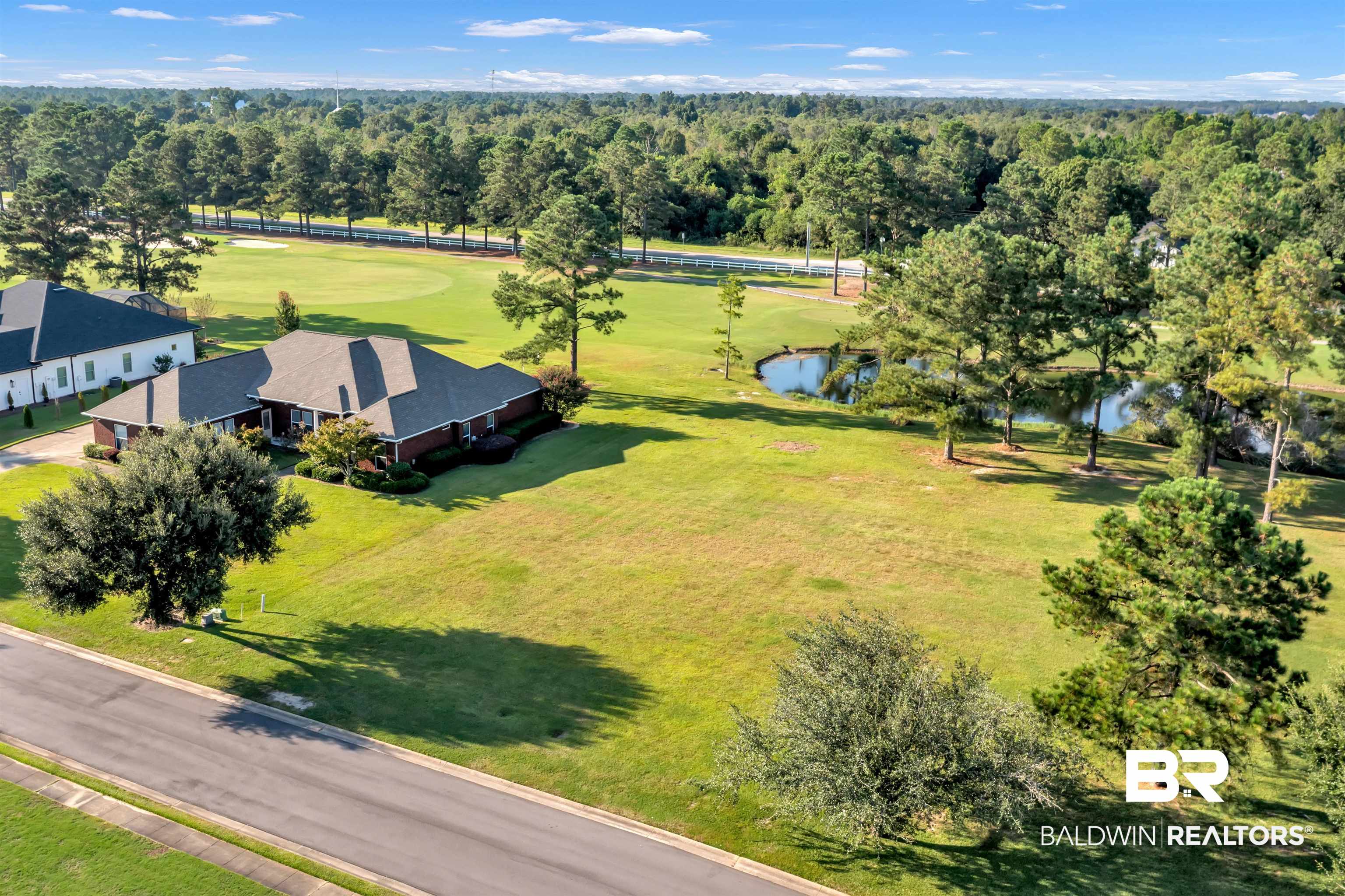 Lakes Circle Gulf Shores, AL 36542 - Photo 1 of 15 Aerial view of a golf course and a large body of water