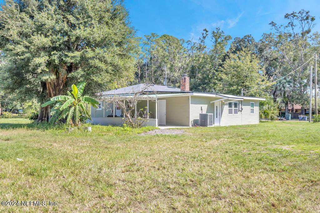 9750 Hood Road Jacksonville, FL 32257 - Photo 1 of 53 a front view of a house with garden