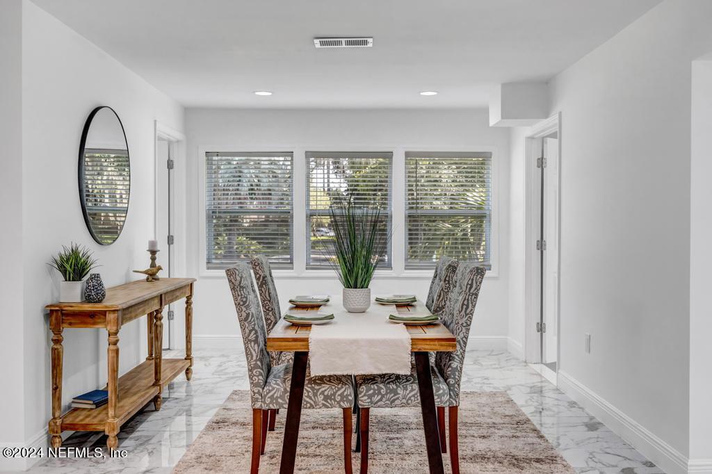 9750 Hood Road Jacksonville, FL 32257 - Photo 11 of 53 a view of a dining room with furniture window and outside view