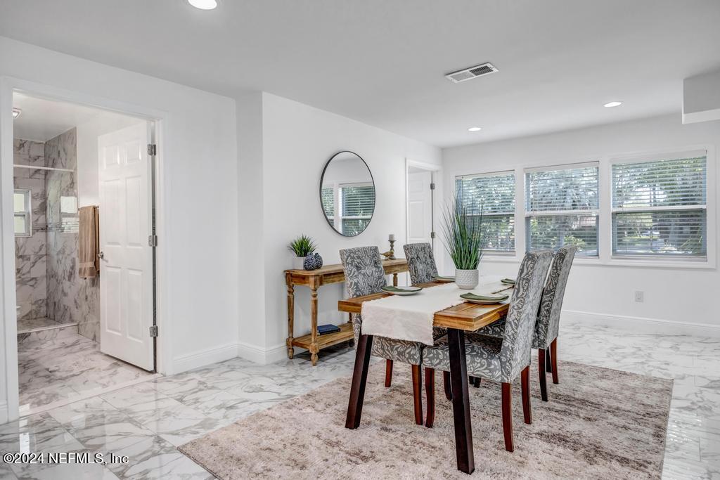 9750 Hood Road Jacksonville, FL 32257 - Photo 12 of 53 a view of a dining room with furniture