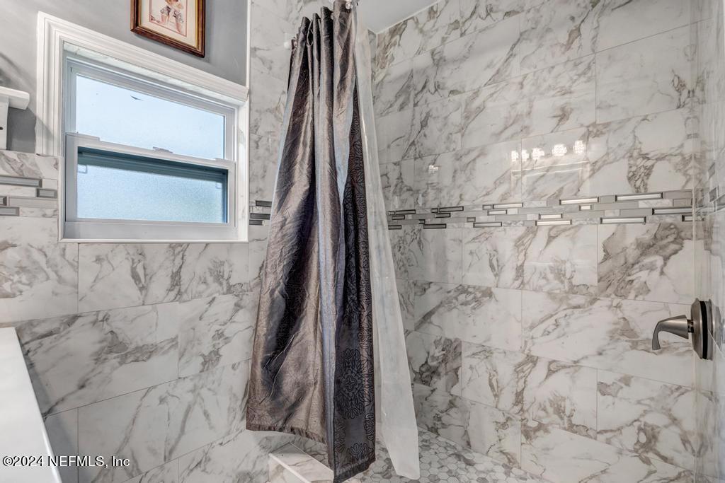 9750 Hood Road Jacksonville, FL 32257 - Photo 23 of 53 a bathroom with a shower