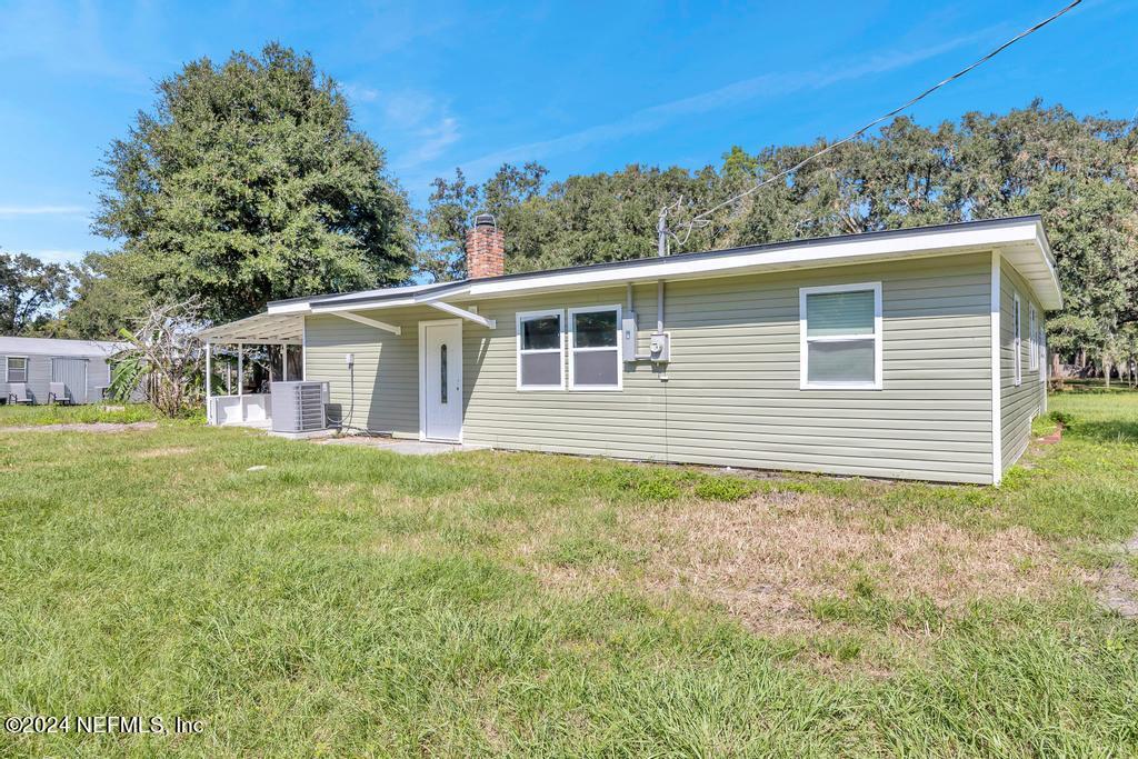 9750 Hood Road Jacksonville, FL 32257 - Photo 37 of 53 a view of a house with backyard and garden