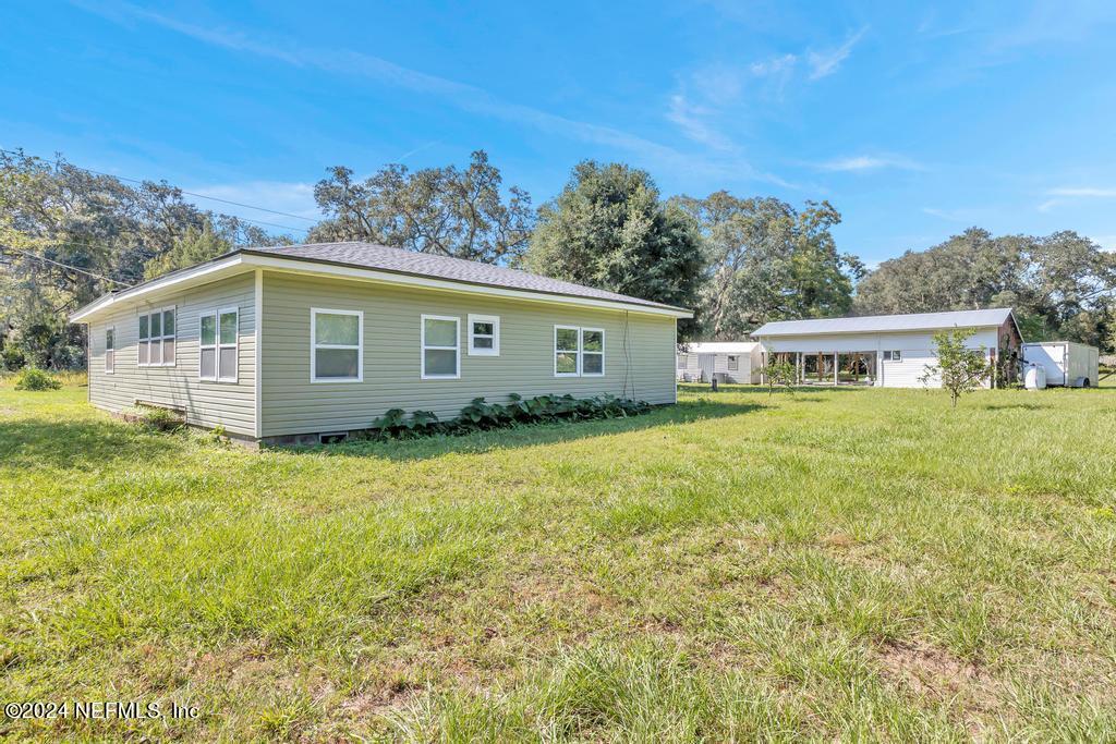9750 Hood Road Jacksonville, FL 32257 - Photo 39 of 53 a view of a house with a backyard