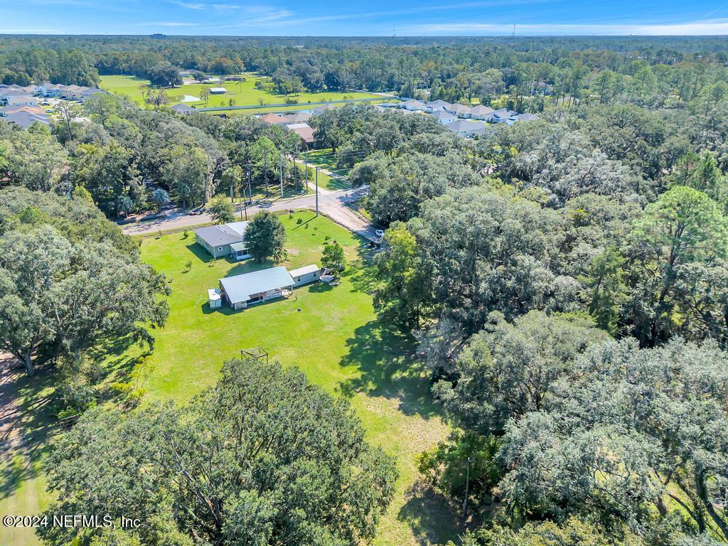9750 Hood Road Jacksonville, FL 32257 - Photo 4 of 53 an aerial view of residential houses with outdoor space and trees