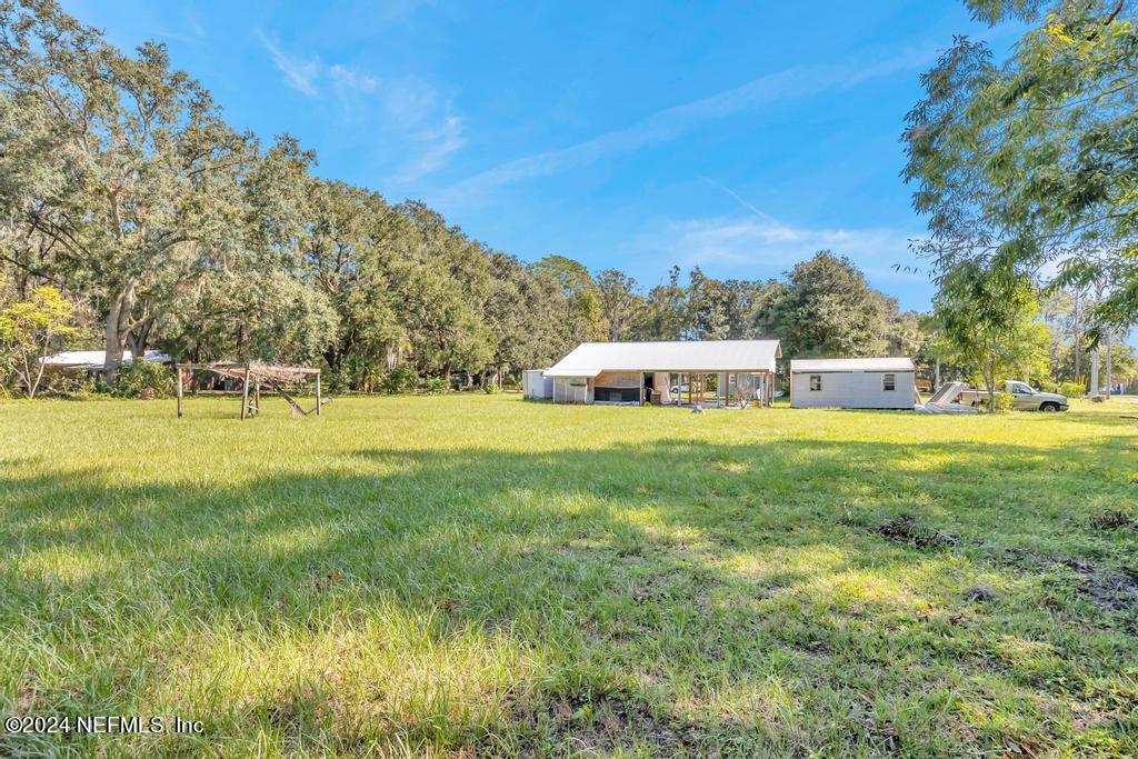 9750 Hood Road Jacksonville, FL 32257 - Photo 42 of 53 a view of outdoor space with garden and trees