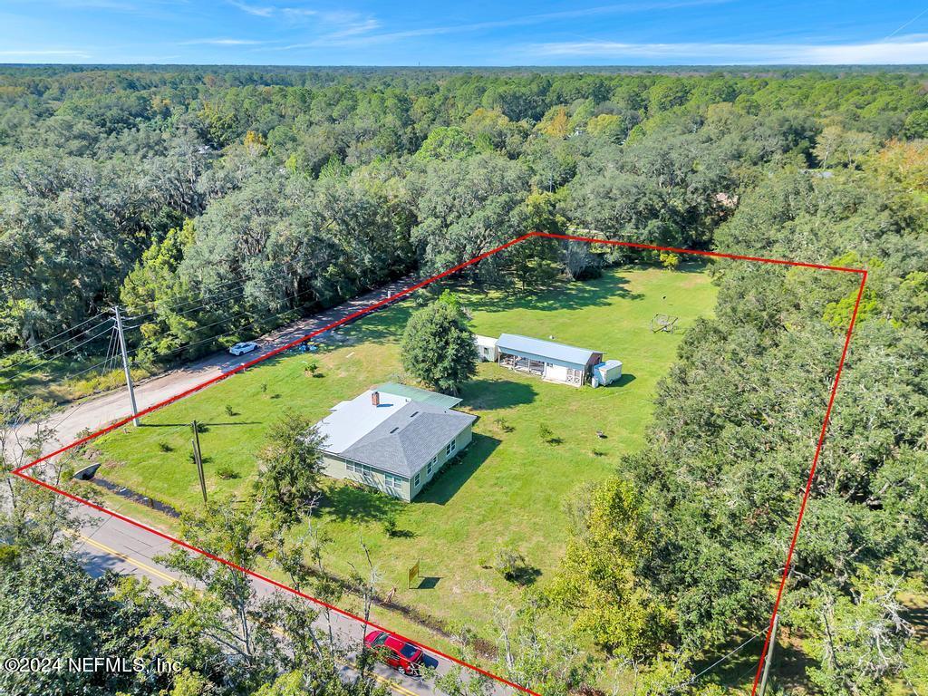 9750 Hood Road Jacksonville, FL 32257 - Photo 45 of 53 a view of a yard with an outdoor seating