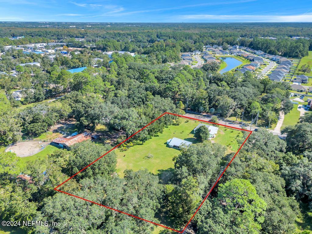 9750 Hood Road Jacksonville, FL 32257 - Photo 47 of 53 an aerial view of a residential houses with a yard and lake view