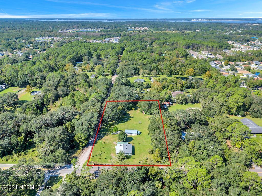 9750 Hood Road Jacksonville, FL 32257 - Photo 48 of 53 an aerial view of a house with a yard and lake view