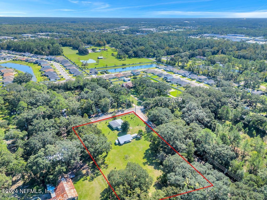 9750 Hood Road Jacksonville, FL 32257 - Photo 51 of 53 an aerial view of residential houses with outdoor space and swimming pool
