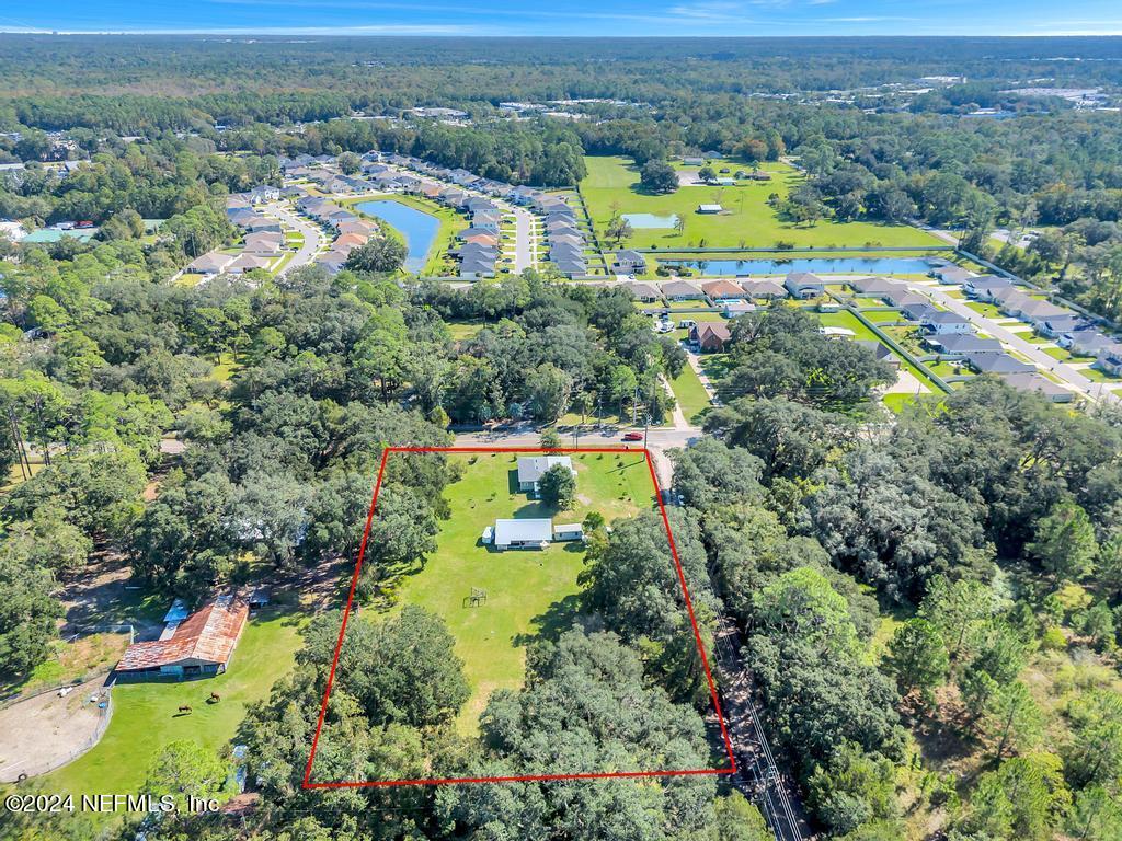 9750 Hood Road Jacksonville, FL 32257 - Photo 52 of 53 an aerial view of a houses with a yard