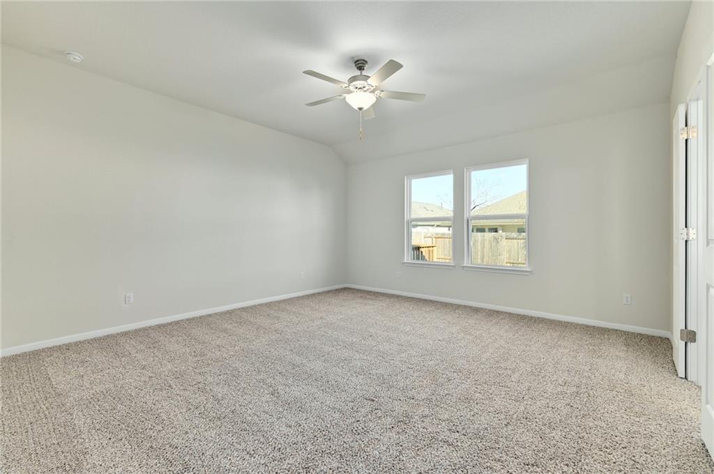 208 Evening Star Lane Georgetown, TX 78628 - Photo 13 of 26 an empty room with a window and a ceiling fan