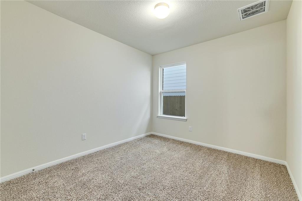 208 Evening Star Lane Georgetown, TX 78628 - Photo 19 of 26 a view of an empty room with a window