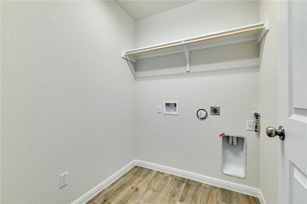 208 Evening Star Lane Georgetown, TX 78628 - Photo 20 of 26 a view of a room with rack on the wall