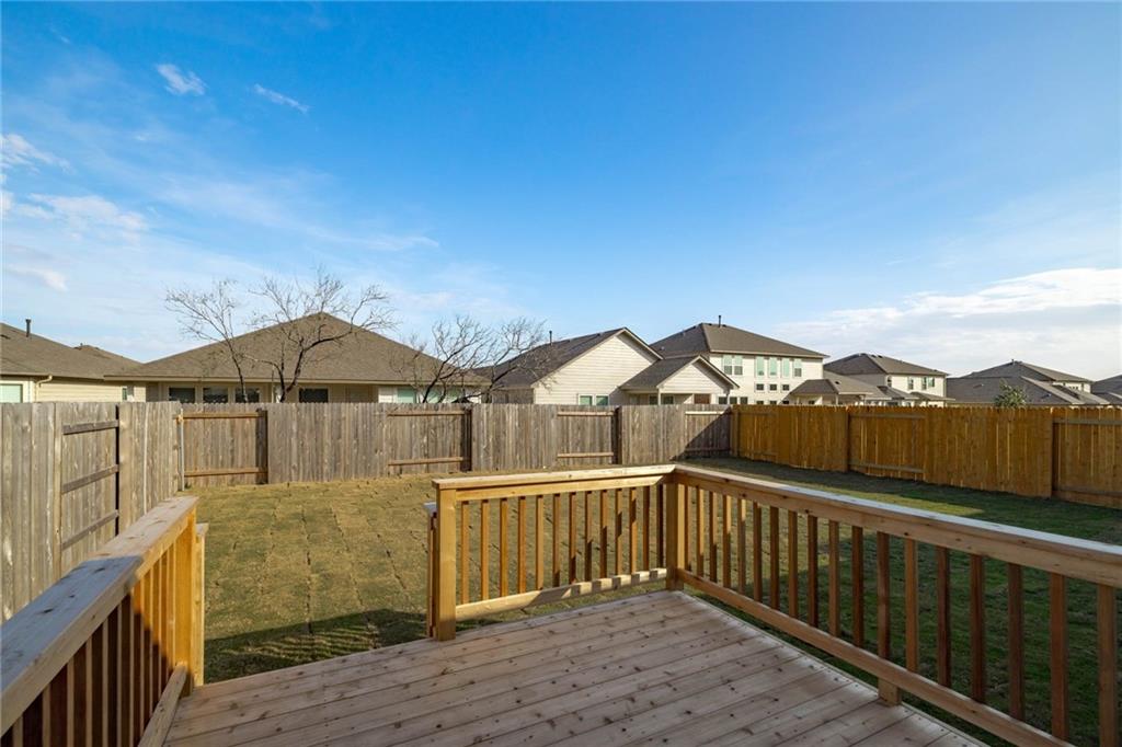 208 Evening Star Lane Georgetown, TX 78628 - Photo 23 of 26 a view of a house with a wooden fence