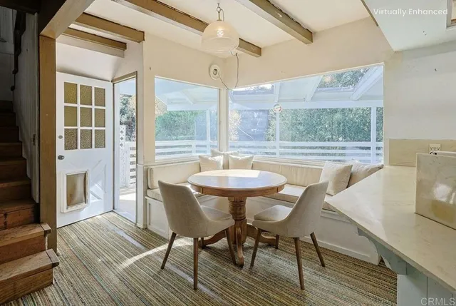 a room with stainless steel appliances granite countertop a sink and a refrigerator