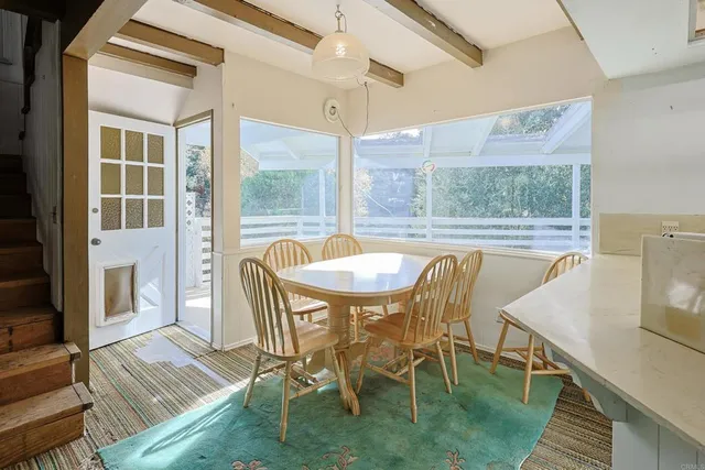 a kitchen that has a sink a stove and a microwave oven in it