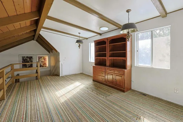 a view of a two chairs in the balcony